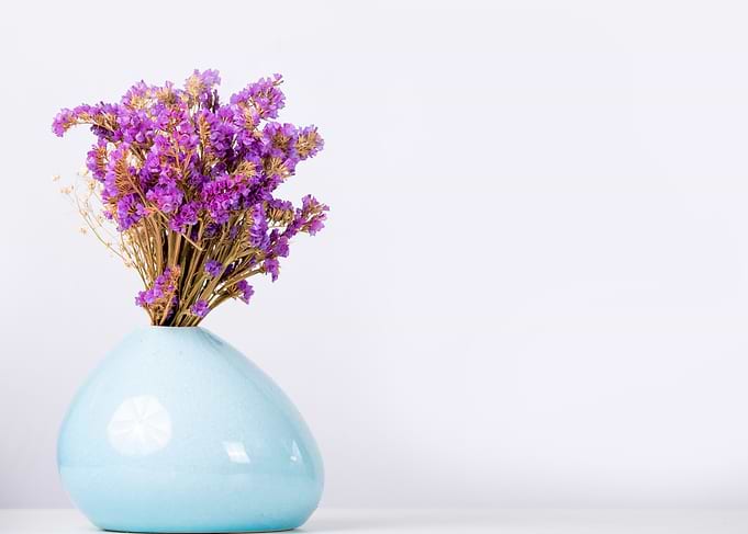Purple Flowers in Blue Vase