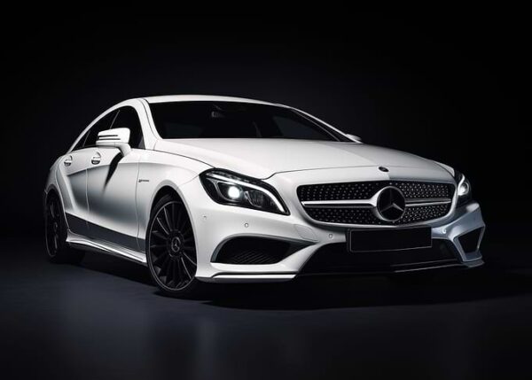 White Mercedes AMG in dark
